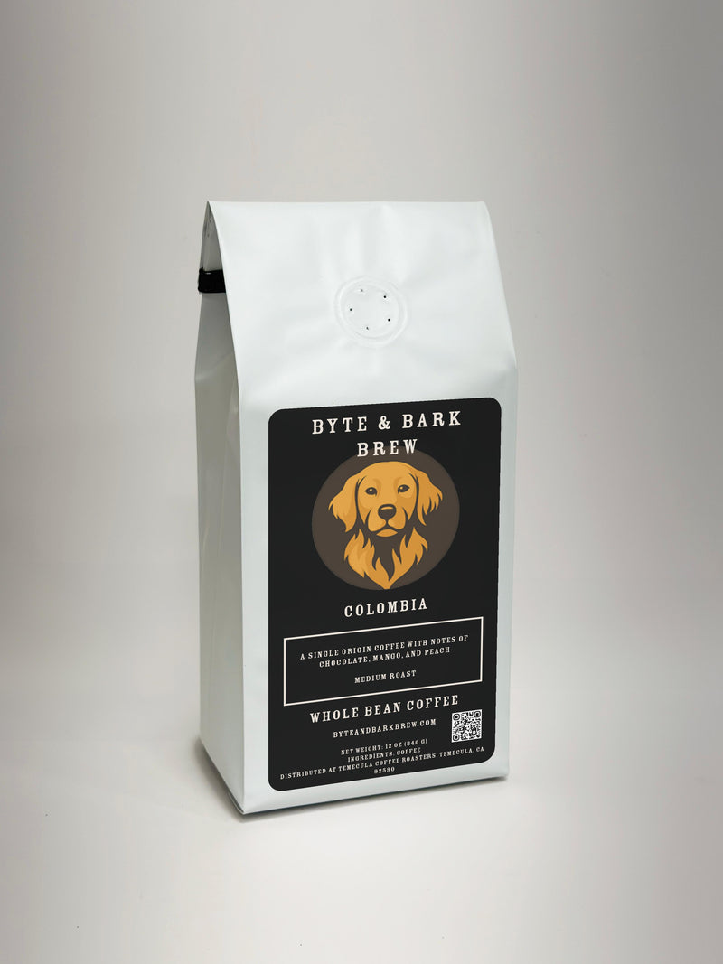 White coffee bag with Byte & Bark Brew® black label, dog logo and 'Colombia' text