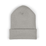Top view of folded light gray knit beanie showing cuff, rounded crown, and textured knit on white background