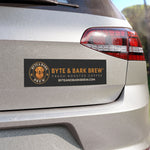 Rear silver hatch with black Byte & Bark Brew® rectangular car magnet featuring dog logo