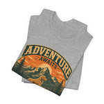 Folded heather gray t-shirt laid flat showing vintage circular mountain, sun, and dog graphic