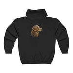 Black hooded sweatshirt laid flat showing centered metallic gold stylized dog head graphic
