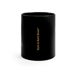 Glossy black mug with vertical golden Byte & Bark Brew® logo visible on white background