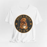 White crewneck tee with Byte & Bark Brew® circular logo showing golden retriever holding coffee