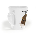 Close-up of white ceramic mug showing handle and Byte & Bark Brew® logo with decorative brown illustration