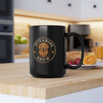 Glossy black mug with circular Byte & Bark Brew® logo showing a golden retriever, front-close view