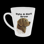 White ceramic latte mug showing Byte & Bark Brew® text and detailed dog illustration