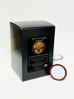Black rectangular box labeled Byte & Bark Brew® with dog logo and two single-serve pods