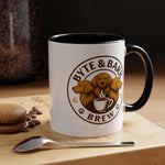 White mug with black interior and handle featuring Byte & Bark Brew® logo close-up