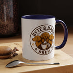 White ceramic mug with navy interior and handle displaying Byte & Bark Brew® dog logo