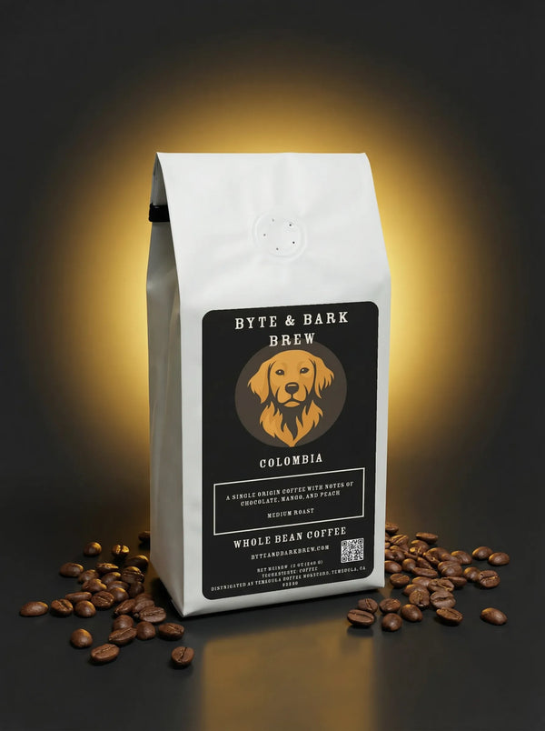 White Byte & Bark Brew® coffee bag labeled Colombia with dog logo, beans scattered below