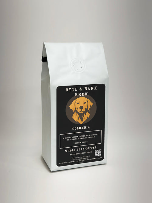 White coffee bag with Byte & Bark Brew® black label, dog logo and 'Colombia' text