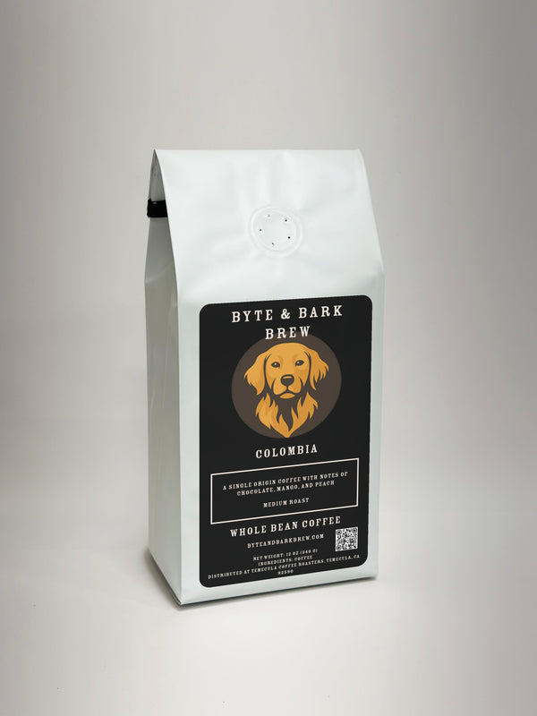 White coffee bag with Byte & Bark Brew® black label, dog logo and 'Colombia' text