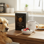 Black Byte & Bark Brew® coffee box beside steaming 'Breakfast Blend' mug, bowl of berries, and dog