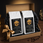 Gift box with two Byte & Bark Brew® whole-bean coffee bags, gold ribbon and scattered beans
