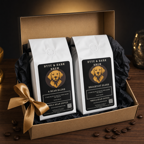 Gift box with two Byte & Bark Brew® whole-bean coffee bags, gold ribbon and scattered beans