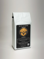 White sealed coffee bag with Byte & Bark Brew® Uganda label and dog logo