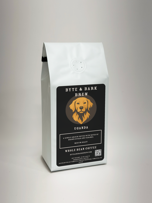 White sealed coffee bag with Byte & Bark Brew® Uganda label and dog logo