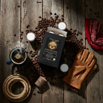 Open Byte & Bark Brew® coffee pod box with pods and scattered beans on rustic wooden surface