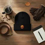 Black knit beanie with small round embroidered yellow dog patch centered on cuff