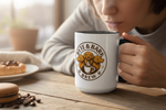 White ceramic mug with black handle and interior showing Byte & Bark Brew® logo and steam
